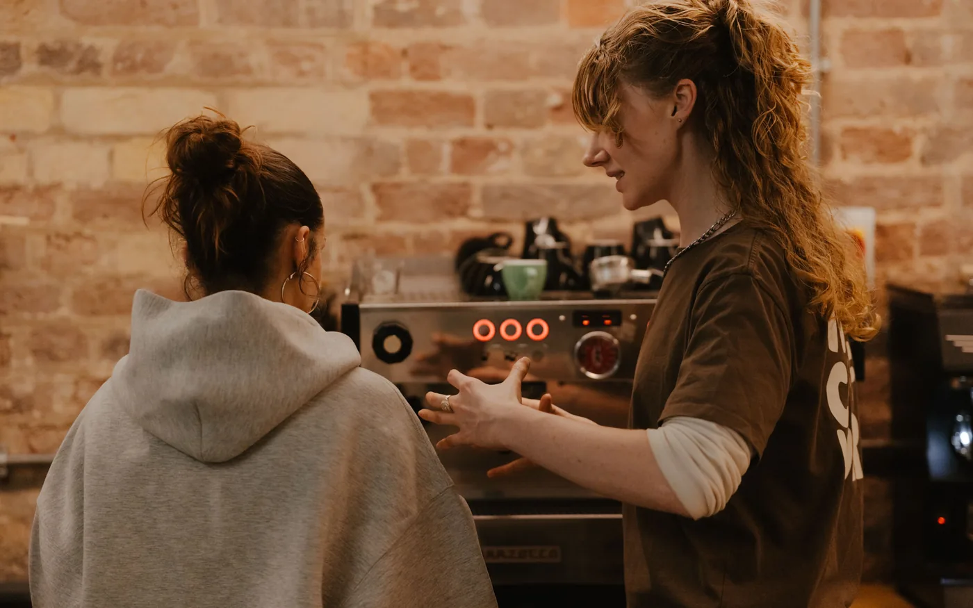 Barista training on the espresso machine at Volcano Coffee Works, Brixton