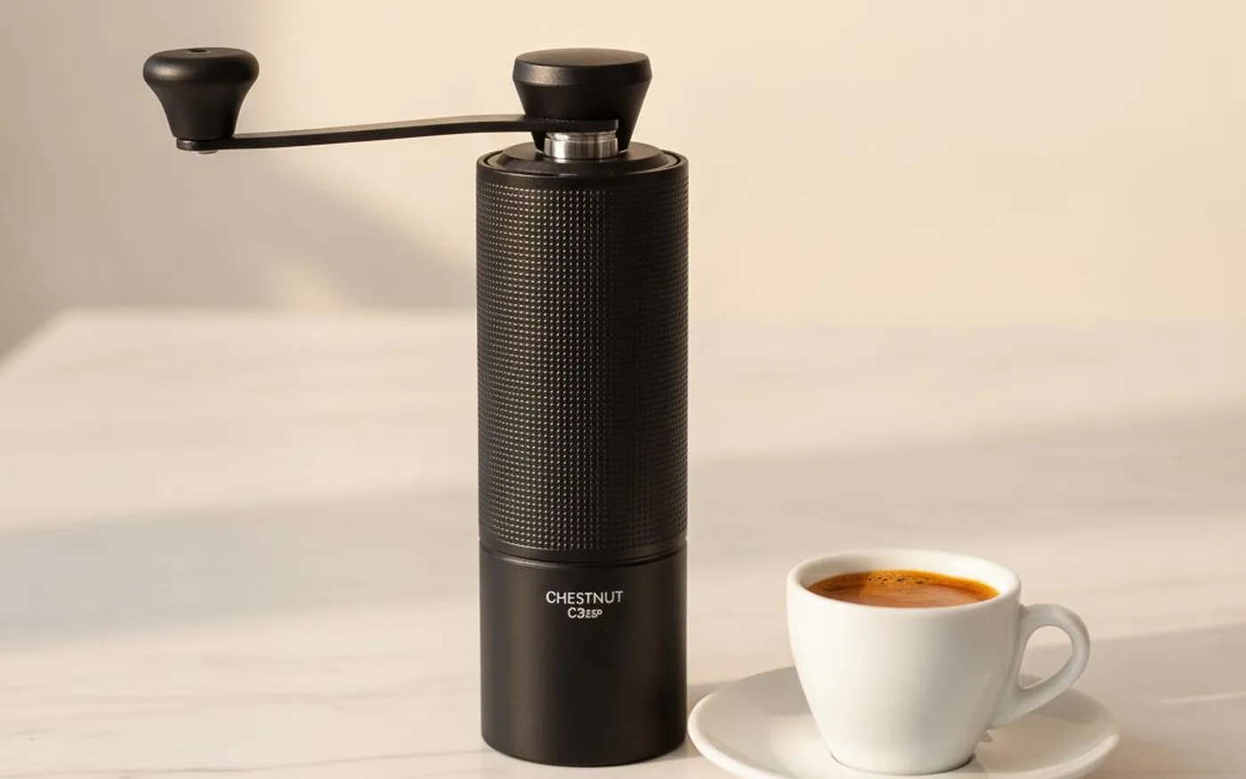 Timemore Chestnut C3 ESP next to an espresso shot in a demitasse