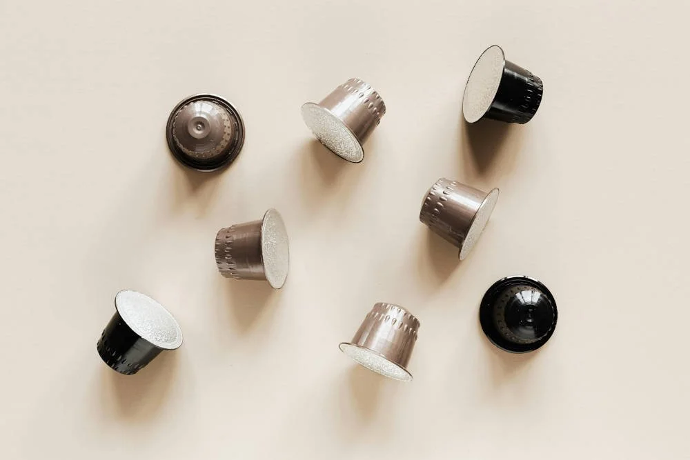 Best organic coffee pods UK 2026 - selection of certified organic coffee pod and capsule brands on white marble