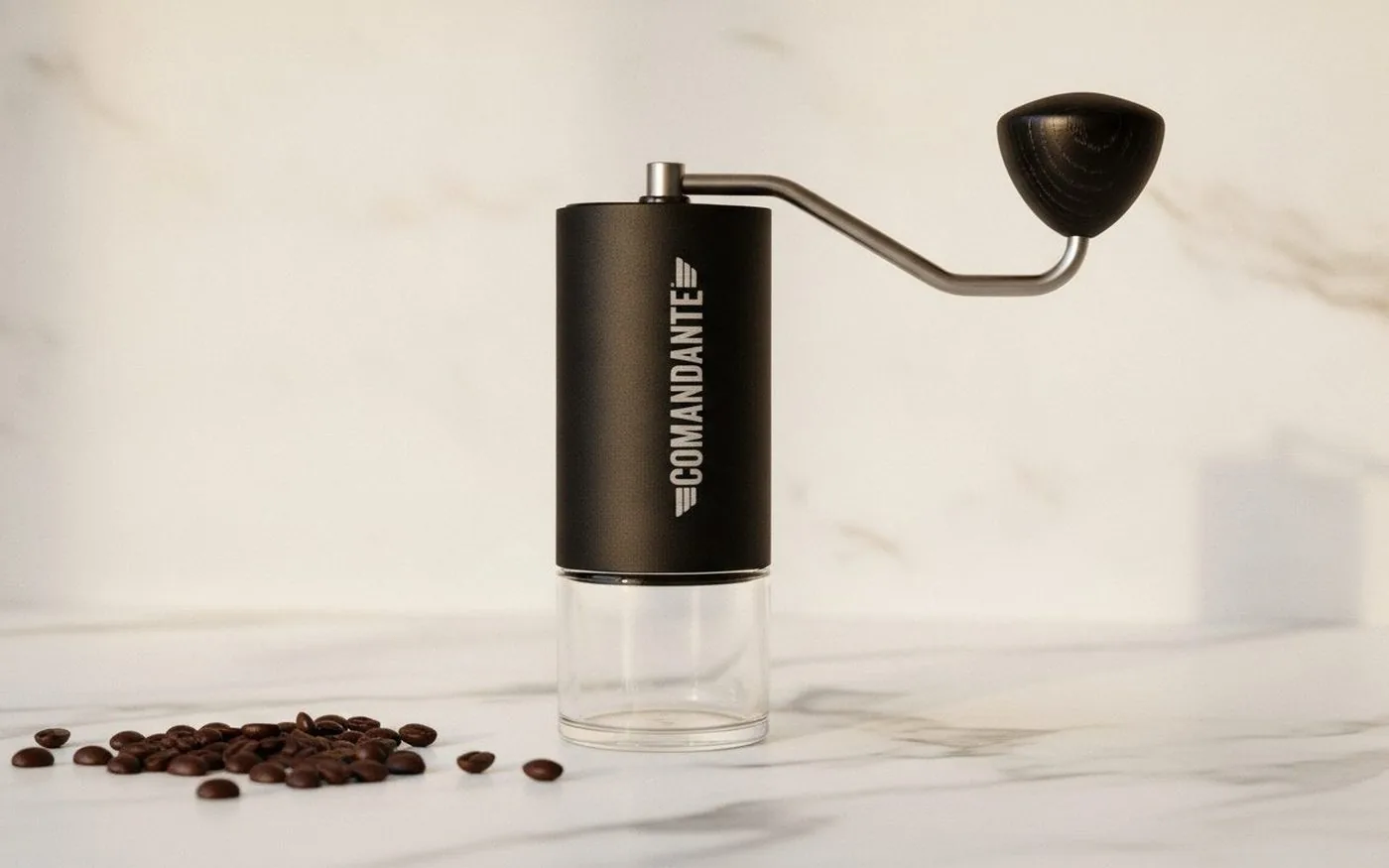 Comandante C40 manual hand grinder on white marble countertop