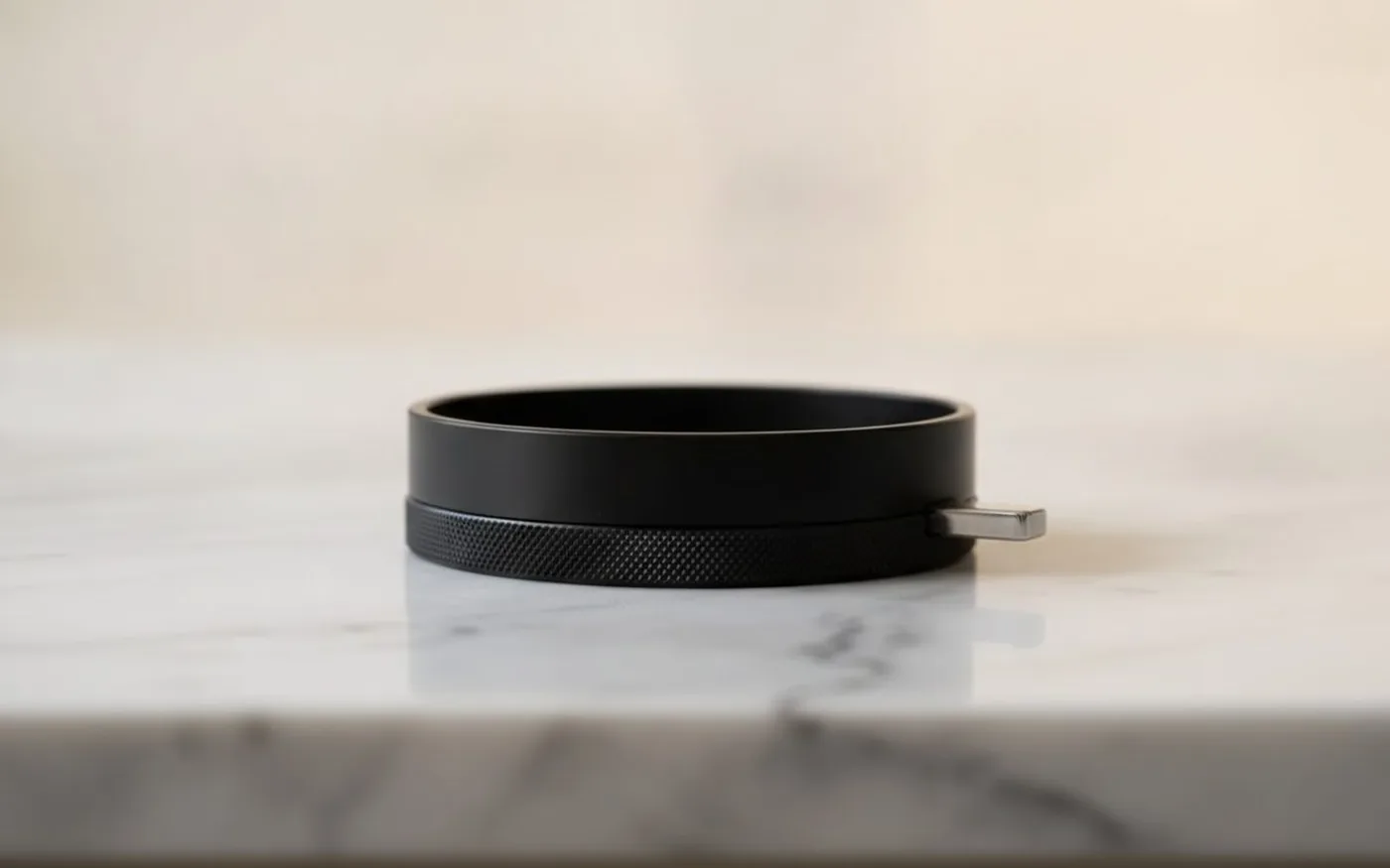 Close-up of coffee grinder stepless adjustment dial with calibration markings