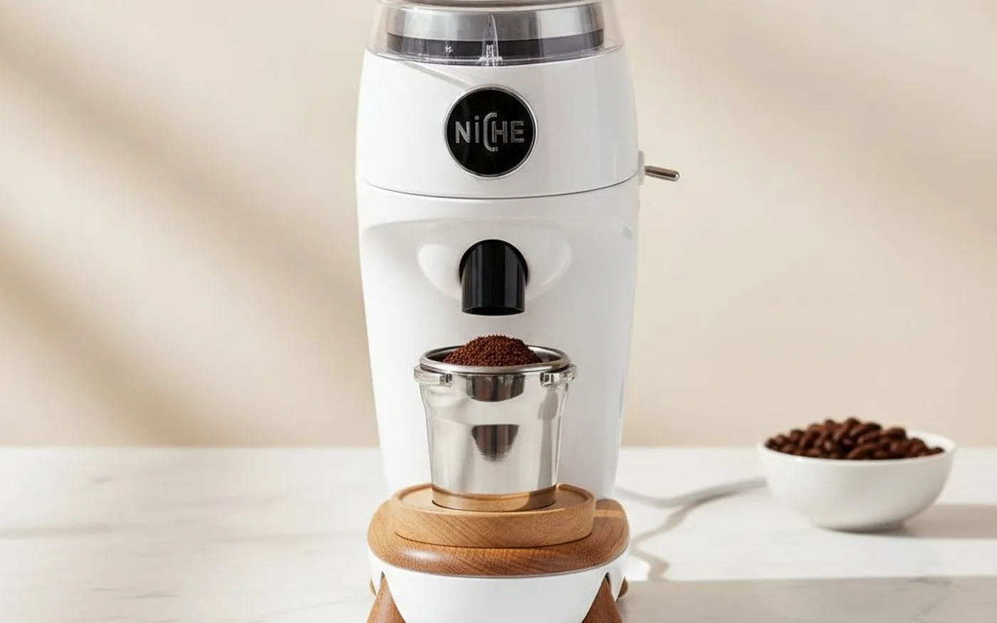 Niche Zero coffee grinder on white marble countertop