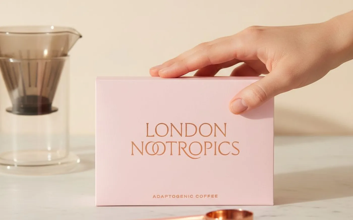 London Nootropics Mojo adaptogenic coffee pink box on white marble - UK mushroom coffee brand