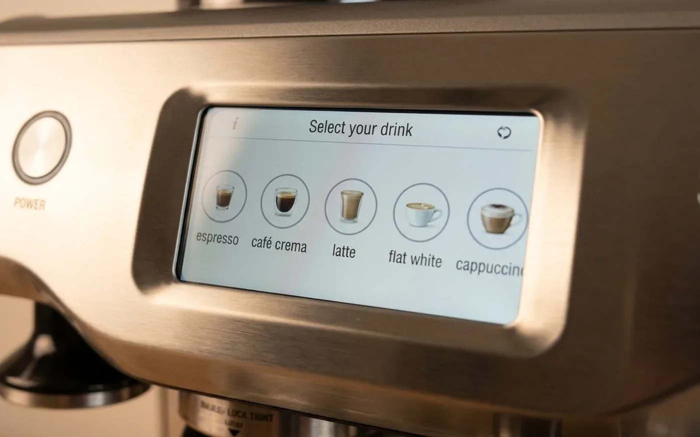 The Sage Oracle Touch 5.7-inch TFT colour touchscreen displaying the drink selection menu with espresso, cafe crema, latte, flat white and cappuccino options